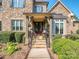 Charming front porch with stone steps and decorative plants at 1377 Shinnecock Ln, Fort Mill, SC 29707