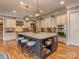 Gourmet kitchen with large island, stainless steel appliances, and custom cabinets at 1377 Shinnecock Ln, Fort Mill, SC 29707