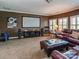 Entertainment room offers theater screen, leather recliners and plantation shutters at 1377 Shinnecock Ln, Fort Mill, SC 29707