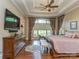 Bright main bedroom with large window, hardwood floors and tray ceilings at 1377 Shinnecock Ln, Fort Mill, SC 29707