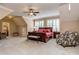 Spacious primary bedroom with ample natural light, sitting area, and neutral tones offers a serene retreat at 1377 Shinnecock Ln, Fort Mill, SC 29707