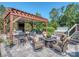 Enjoy this outdoor kitchen with a built-in grill, bar seating and a hot tub for entertaining at 1377 Shinnecock Ln, Fort Mill, SC 29707