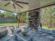Outdoor living space with brick fireplace and comfortable seating for relaxing with friends and Gathering at 1377 Shinnecock Ln, Fort Mill, SC 29707