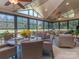 Bright sunroom featuring vaulted ceilings, large windows, and cozy seating at 1377 Shinnecock Ln, Fort Mill, SC 29707
