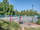 Spacious tennis courts surrounded by mature trees and manicured landscaping, promoting an active lifestyle at 1377 Shinnecock Ln, Fort Mill, SC 29707