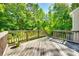 Large wood back deck overlooking a lush green yard at 13916 Mallard Lake Rd, Charlotte, NC 28262