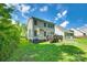 Home's backyard featuring a deck, patio, green grass and partial view of the back exterior at 13916 Mallard Lake Rd, Charlotte, NC 28262