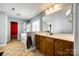 Primary bathroom features a double sink vanity, soaking tub and a separate shower at 13916 Mallard Lake Rd, Charlotte, NC 28262