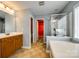 Bathroom with double sink vanity, soaking tub and separate glass shower at 13916 Mallard Lake Rd, Charlotte, NC 28262