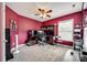 Bedroom with fan, carpet, window, and built in shelves and desk at 13916 Mallard Lake Rd, Charlotte, NC 28262