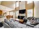 Bright living room with tall ceilings, large windows, and comfortable seating arrangement at 13916 Mallard Lake Rd, Charlotte, NC 28262