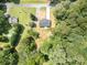 Aerial view of single Gathering home surrounded by green trees at 157 Fraley Rd, Gastonia, NC 28052