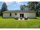 Expansive backyard features a patio with outdoor seating and lush lawn at 157 Fraley Rd, Gastonia, NC 28052