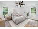 Bright bedroom featuring a ceiling fan, natural light, and decor at 157 Fraley Rd, Gastonia, NC 28052