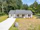 Charming single story home with white siding and a large front yard at 157 Fraley Rd, Gastonia, NC 28052