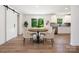 Modern kitchen and dining area featuring stainless steel appliances and wooden floors at 157 Fraley Rd, Gastonia, NC 28052