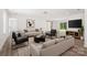 Inviting living room with ample seating, modern decor, and large sliding doors offering scenic views at 157 Fraley Rd, Gastonia, NC 28052