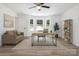 Bright home office with large windows, neutral tones, and a comfortable seating area at 157 Fraley Rd, Gastonia, NC 28052
