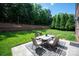 Backyard with patio set and decorative outdoor rug, perfect for relaxation at 16016 Reynolds Dr, Fort Mill, SC 29707