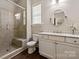 Bathroom featuring glass-enclosed shower, stone tile, and vanity with stone countertop at 16016 Reynolds Dr, Fort Mill, SC 29707