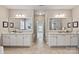 Primary bath with dual vanities, granite countertops, framed mirrors, and walk-in shower at 16016 Reynolds Dr, Fort Mill, SC 29707