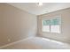 Neutral bedroom featuring carpet flooring, a window for natural light, and ample wall space at 16016 Reynolds Dr, Fort Mill, SC 29707