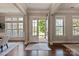 Bright foyer featuring hardwood floors, neutral paint, and an open view to the outdoors at 16016 Reynolds Dr, Fort Mill, SC 29707