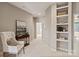 Inviting hallway with chair, console table, decor, and built-in shelves at 16016 Reynolds Dr, Fort Mill, SC 29707