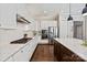 Chef's kitchen featuring a gas cooktop, stainless appliances, white cabinets, and granite countertops at 16016 Reynolds Dr, Fort Mill, SC 29707
