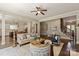 Open-concept living room with hardwood floors seamlessly connecting to the kitchen at 16016 Reynolds Dr, Fort Mill, SC 29707