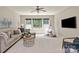 Cozy living room with a ceiling fan, large windows, a comfortable sofa, and a play tent at 16016 Reynolds Dr, Fort Mill, SC 29707