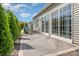 Cozy back patio with seating area, privacy shrubs, and view of the yard at 16260 Raven Crest Dr, Indian Land, SC 29707
