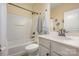 Bright bathroom featuring a shower-tub combo, neutral wall color, and white sink vanity and toilet at 16260 Raven Crest Dr, Indian Land, SC 29707
