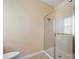 Bathroom featuring a sleek glass-enclosed shower stall and a neutral color scheme, providing a clean and modern look at 16260 Raven Crest Dr, Indian Land, SC 29707
