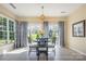 Bright dining area features a table, chairs, sliding glass doors, and view of the backyard at 16260 Raven Crest Dr, Indian Land, SC 29707