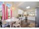 Bright dining area featuring stylish lighting fixture and views of the yard through the large window at 16260 Raven Crest Dr, Indian Land, SC 29707