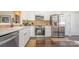 Modern kitchen with stainless steel appliances, sleek countertops, and stylish backsplash at 16260 Raven Crest Dr, Indian Land, SC 29707