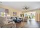 Inviting living room with hardwood floors, a ceiling fan, comfortable seating, and natural light at 16260 Raven Crest Dr, Indian Land, SC 29707