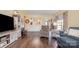Spacious living room featuring hardwood floors, neutral paint, and seamless open-concept design at 16260 Raven Crest Dr, Indian Land, SC 29707