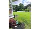 View of well-maintained lawn, garden beds, and welcoming landscaping at 169 Smith Clemmer Rd, Mount Holly, NC 28120