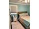 Bright bedroom with light-blue painted walls and a rustic wood headboard at 169 Smith Clemmer Rd, Mount Holly, NC 28120