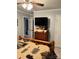 Bedroom with wooden trim, ceiling fan, and mounted TV at 169 Smith Clemmer Rd, Mount Holly, NC 28120