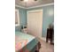 Bedroom boasts neutral decor, light-blue painted walls, and closet at 169 Smith Clemmer Rd, Mount Holly, NC 28120