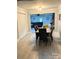 Inviting dining room with modern table and chairs, open to a cozy living area at 169 Smith Clemmer Rd, Mount Holly, NC 28120