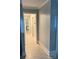 Clean hallway with neutral paint and trim, leading to other rooms in the home at 169 Smith Clemmer Rd, Mount Holly, NC 28120