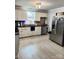 Spacious kitchen featuring stainless steel appliances, white cabinets, and elegant countertops at 169 Smith Clemmer Rd, Mount Holly, NC 28120