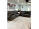 Large living room with stylish gray seating and abundant natural light at 169 Smith Clemmer Rd, Mount Holly, NC 28120