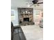 Cozy living room featuring stone fireplace with decorative mantle and neutral color palette at 169 Smith Clemmer Rd, Mount Holly, NC 28120