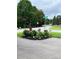 Charming corner with flower bed and street sign marking Smith Dairy Rd at 169 Smith Clemmer Rd, Mount Holly, NC 28120