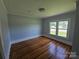Bedroom features hardwood floors and bright windows at 1704 16Th Ne St, Hickory, NC 28601